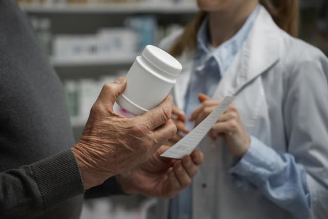 Pharmacist helping patient