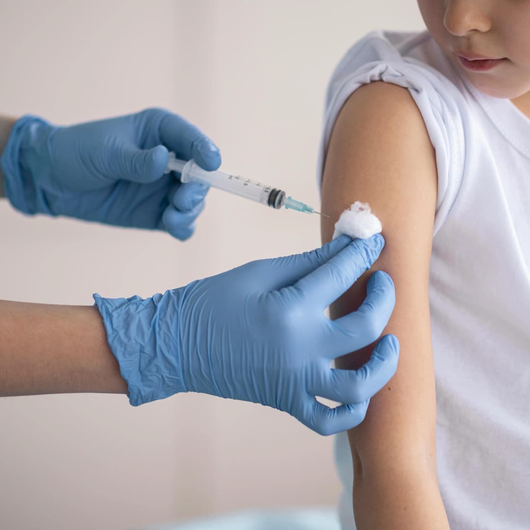 Pharmacist administering vaccination at Flanders Pharmacy