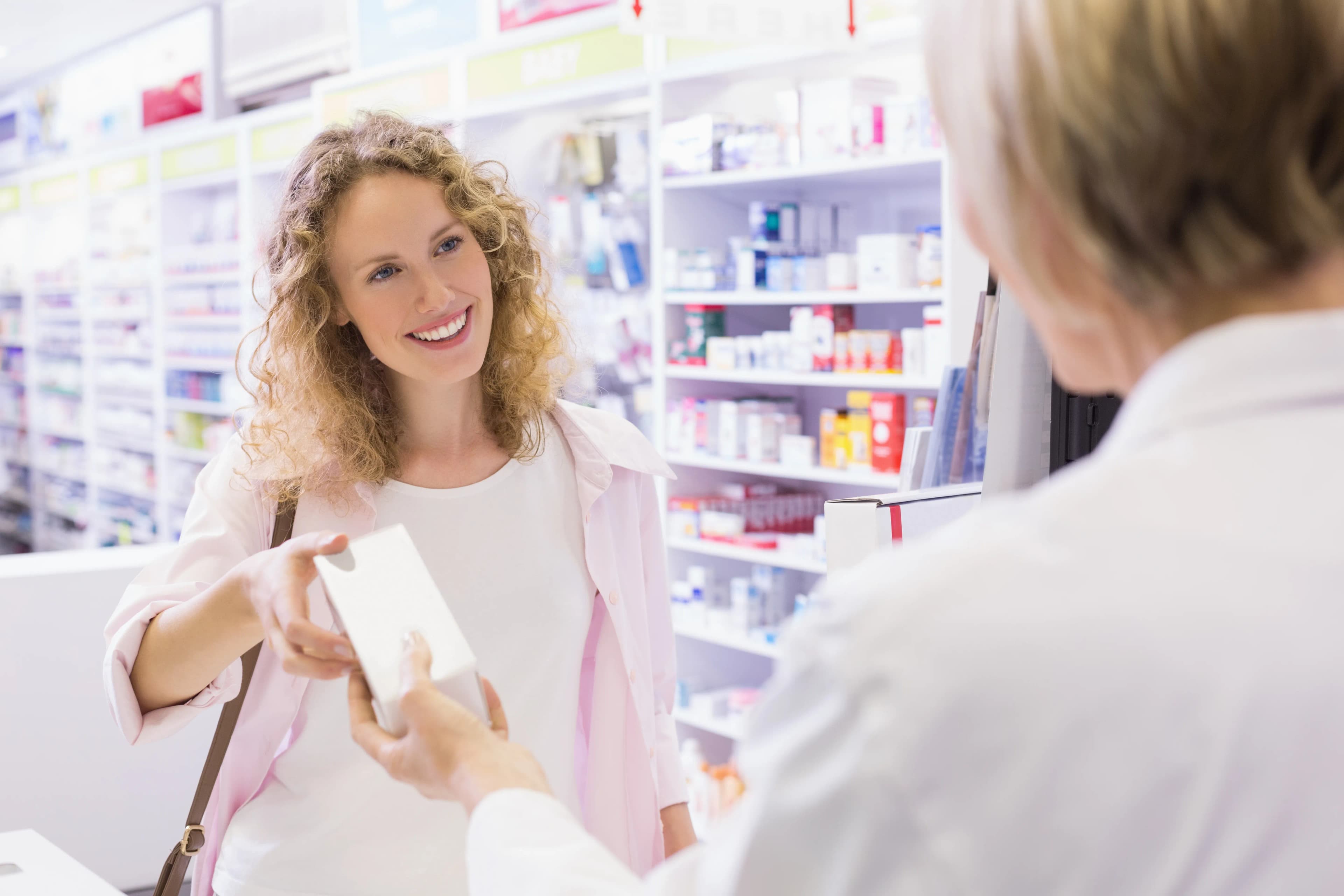 Pharmacist consulting with patient